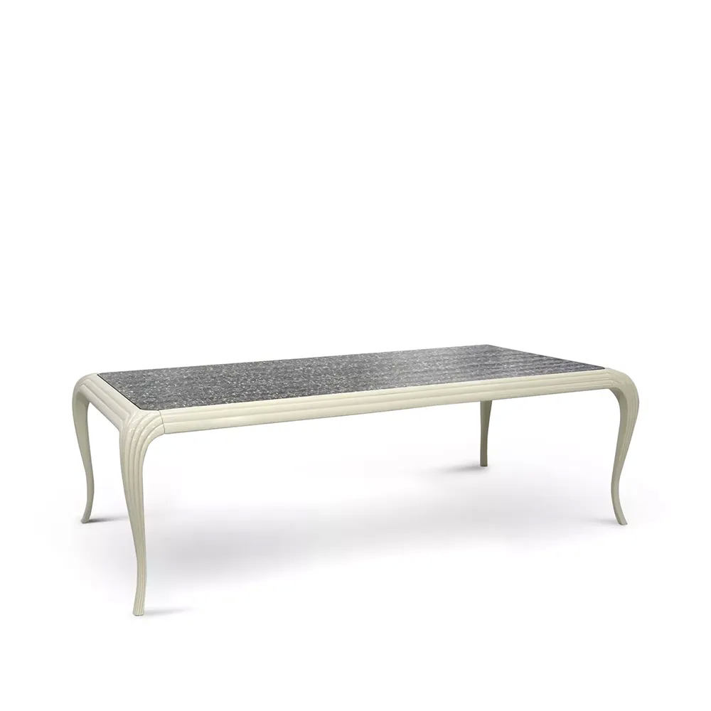 Dining table with exposed feathers under glass at the top, supported on arched lacquered legs.